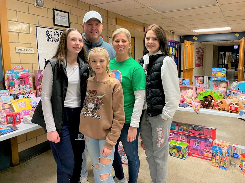 The McGovern family has collected toys for Doorways for the past five years.   (L to R: Kaylen, Brian, Marley, Jennifer and Kerrin McGovern.)