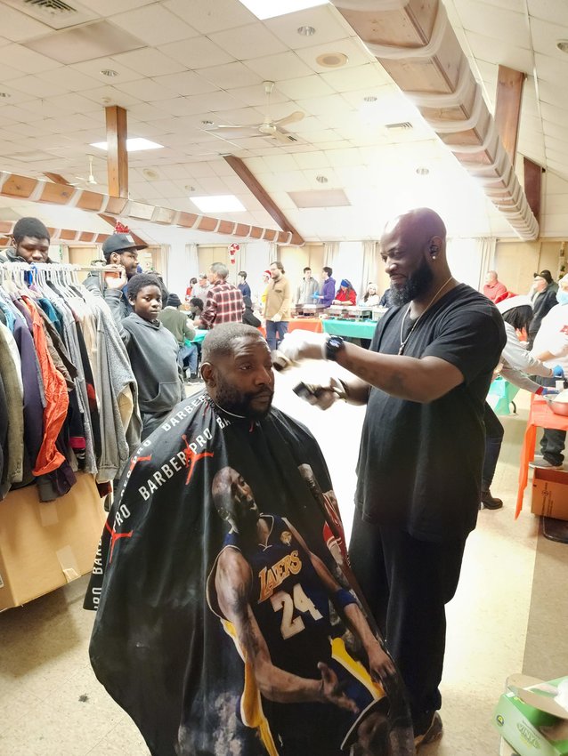 Barber Anton McGowan provided free haircuts and styling on Christmas Day at the Together for Ep community dinner at the Brightridge Club.