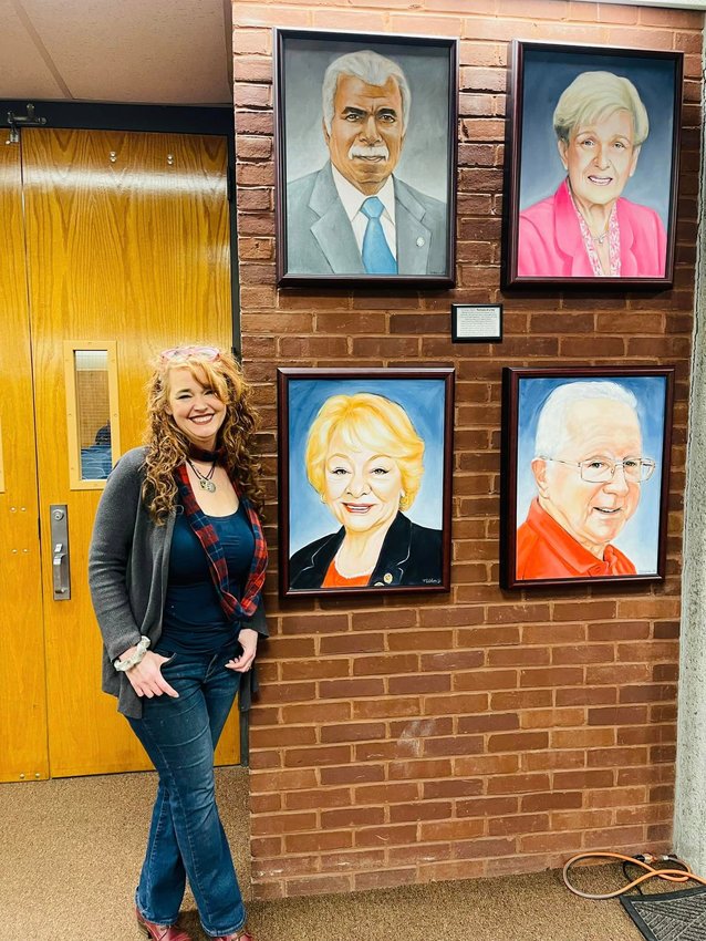 Artist Jennifer Gillooly Cahoon with her  winning portraits last month.