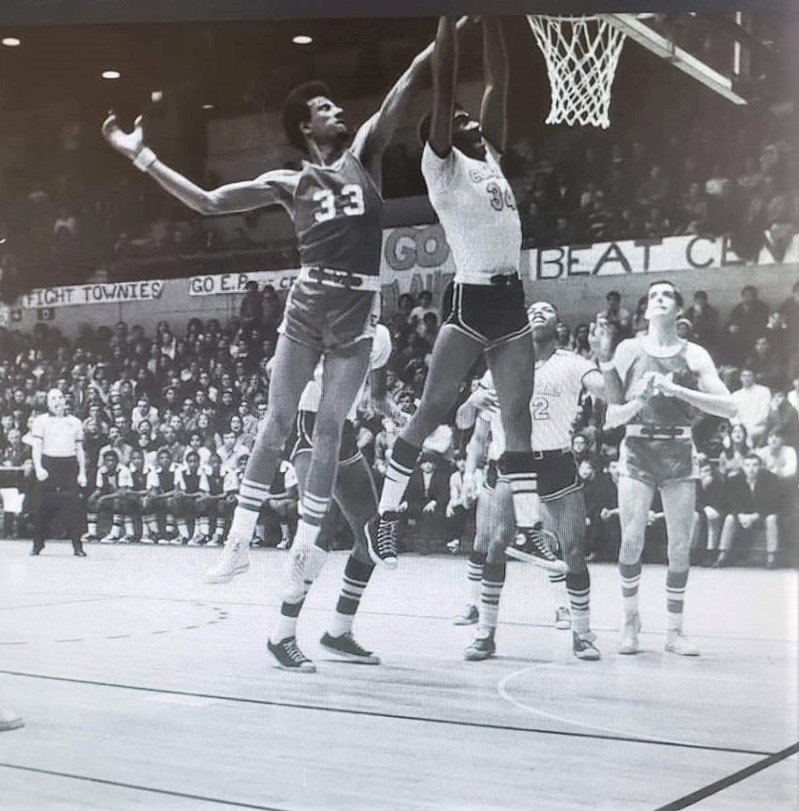Al Soares 33 in action at the net against Central's Rick Santos in classic 1969 State Championship game televised at PC's Alumni Hall.  Knights Marvin Barnes and Townies Ralph Roberti in background.