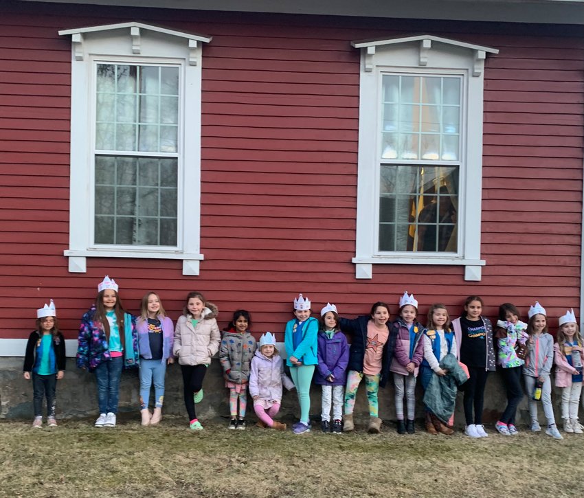 East Providence Girl Scout Daisy Troop 103 and Brownie Troop 989 are shown relaxing after working together to earn their Daisy and Brownie Safety Pins.