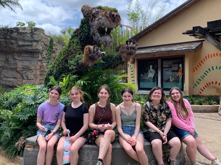 Members of East Providence Girl Scout Troop 519 are shown relaxing after an exhilarating day at Busch Gardens