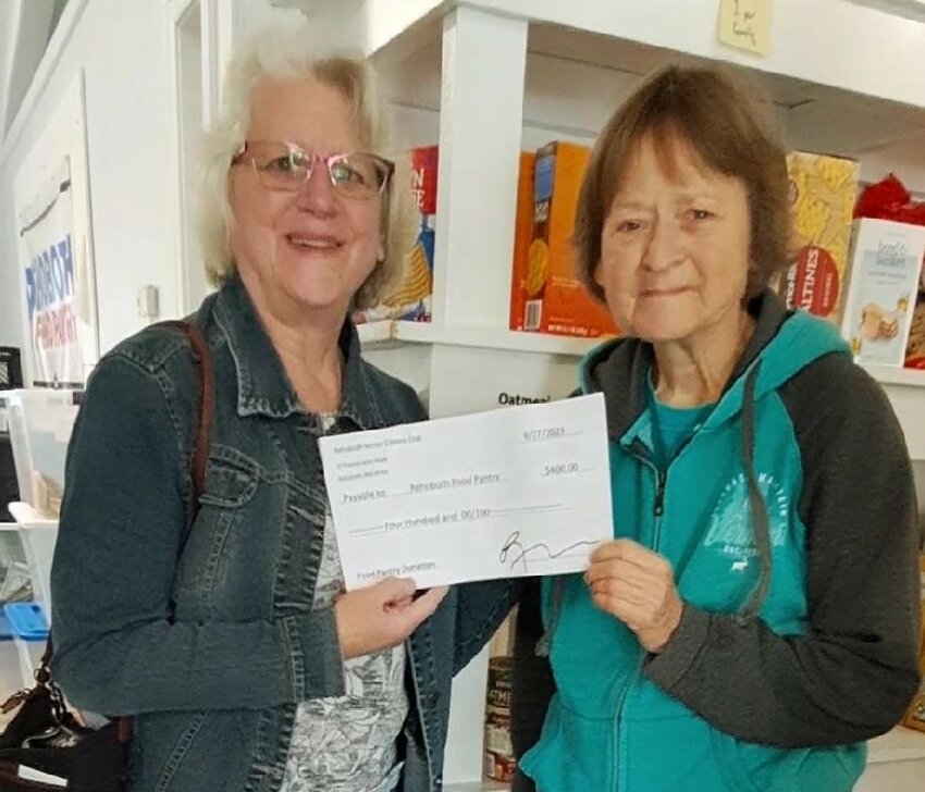 Jane Williams presenting our check to Paula Fernandes of the Food Pantry.