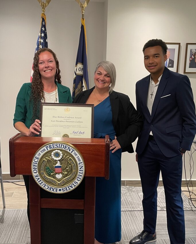 &bull;EPPC Director Madeline Marlow, EPPC Youth &amp; Media Relations Coordinator Bethanie Rado and East Providence Youth Council (EPYC) representative Tristen Nunes holding the Blue Ribbon Coalition award presented by the EOP and ONDCP.