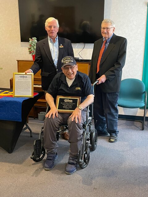 Ret. U.S. Navy Chief Petty Officer Ed August, Sr. accepts a citation and plaque commemorating the naming of two &ldquo;Cruiser Compartments&rdquo; aboard the USS Salem museum ship after him. Joining him are U.S. Navy Cruiser Sailors Association President David Blomstrom (right) and Secretary James Chryst (left).