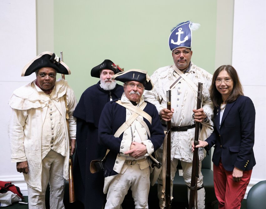 Sen. Linda Ujifusa, right, with Revolutionary War re-enactors visiting the Senate.