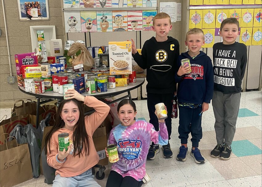 On March 1, Aitken School PTO hosted a Family Bingo Night, with the price of admission being a donation of a non-perishable food item for the Doorways Food Pantry. The event was the second of its kind this school year and raised a great deal of food. Pictured above, Aitken School students pose with some of the donations collected that night.