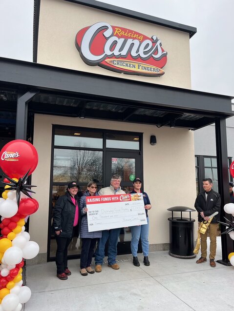 Raising Cane&rsquo;s donated $1,000.00 to the Doorways Food Pantry as part of their Grand Opening festivities  L to R: Carly Ciarletta (Area Marketing Raising Canes), Wendy Ashcroft &amp; Gerry McCabe of Doorways, Julia Dyer (Area Restaurant Leader Raising Cane&rsquo;s)