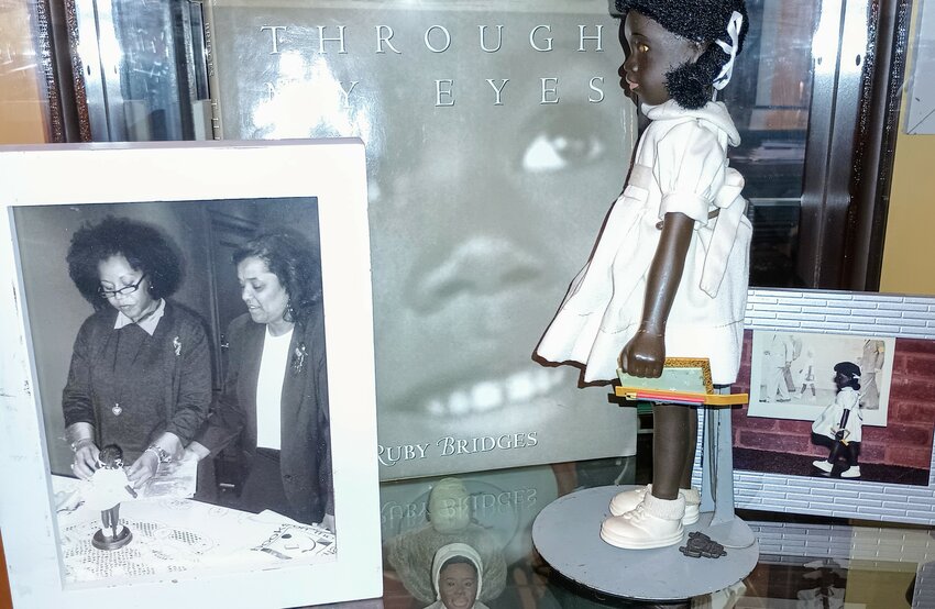 Ruby Bridges at Rhode Island Foundation examining the doll made in her image