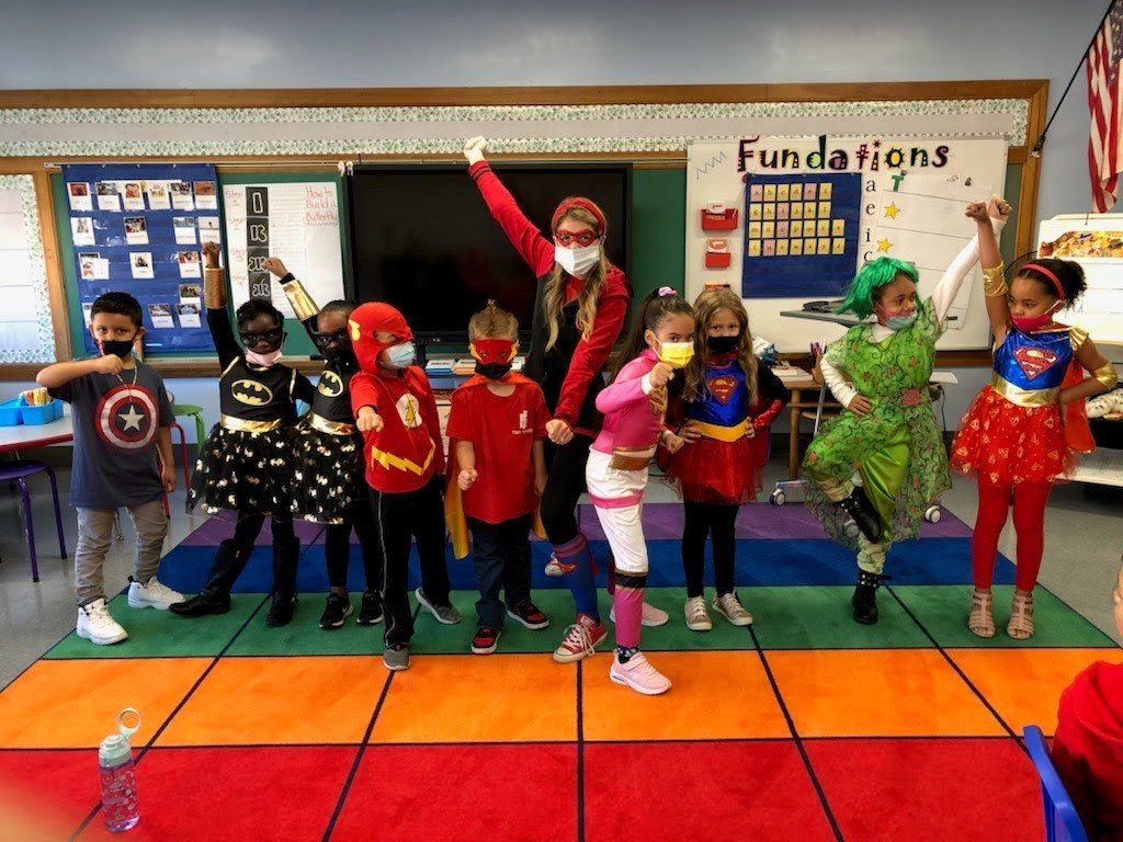 Mrs. Coppa and her 1st grade heroes are ready for Hero Day.