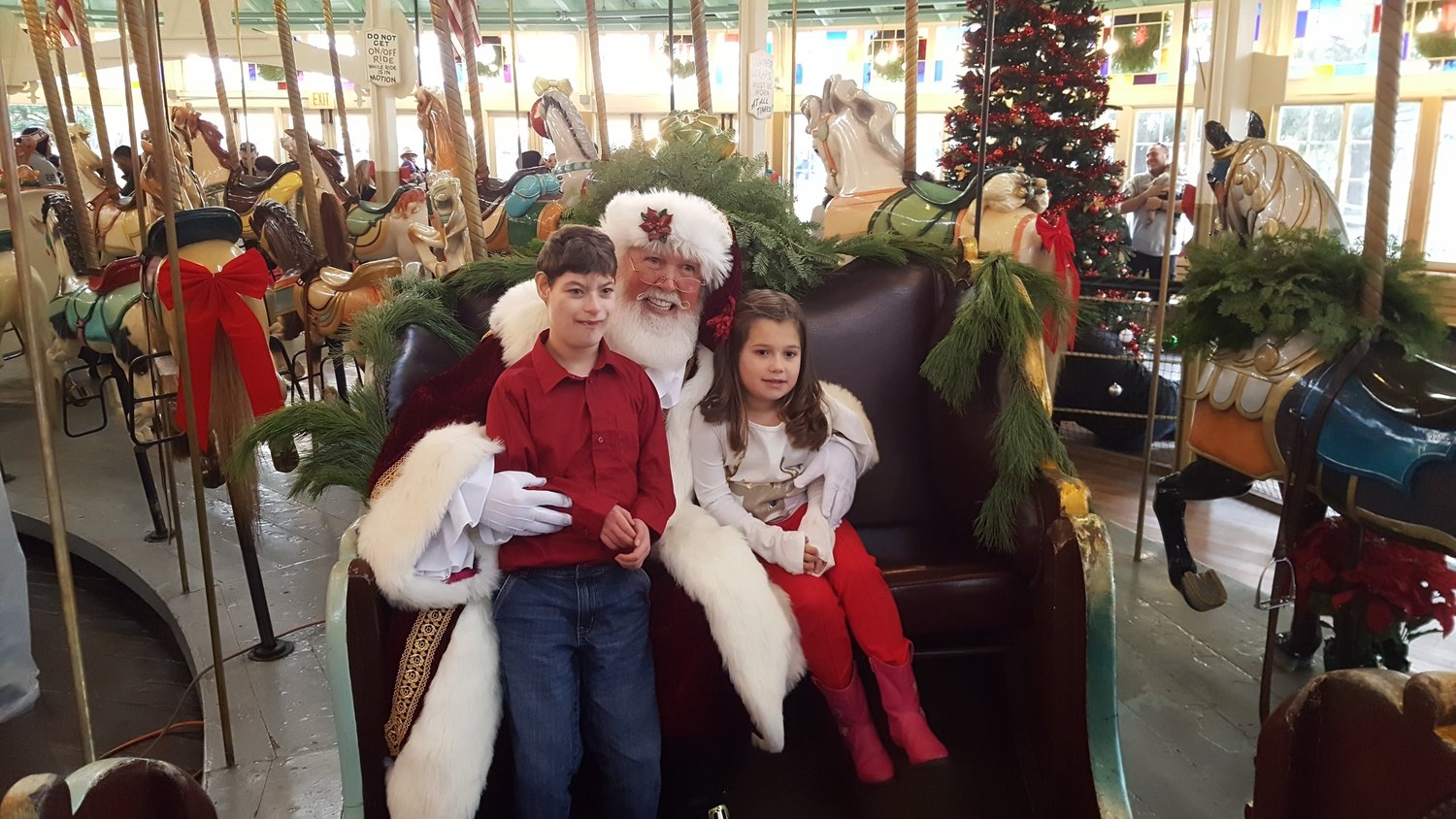Children visiting Santa Bob at the Carousel.