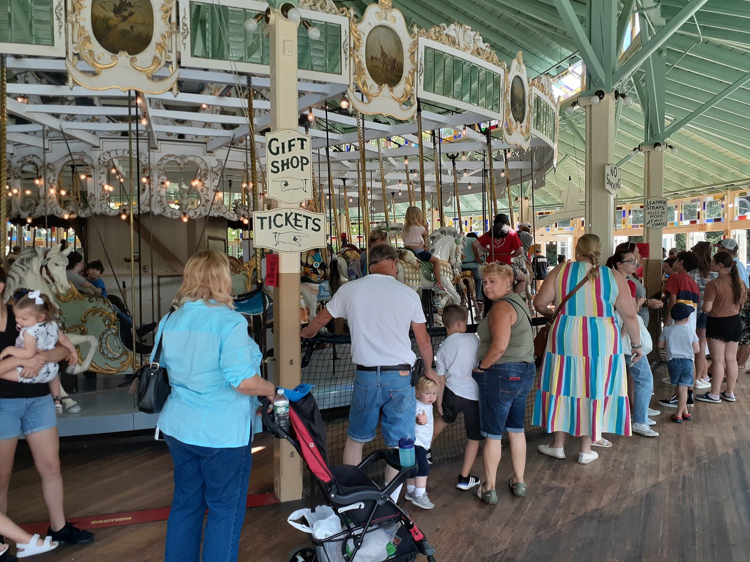 Fans of the Looff Carousel line up for a long anticipated ride at Carousel opening. Bob Rodericks photo