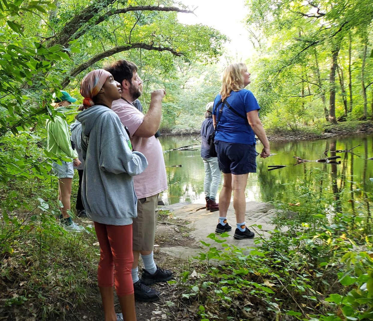 The goal of the Blackstone Valley Tourism Council’s Bird Walk is to see and hear local and migratory songbirds and waterfowl. Here, participants in September’s event watch and listen as they are guided along the Ten Mile River at Hunts Mills in Rumford, R.I. by an Audubon Society guide.