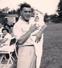 Dad holding me at my christening