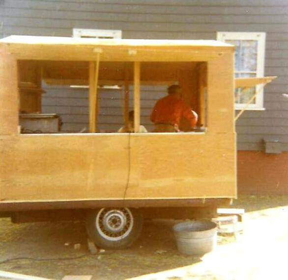 Dad building a traveling concession stand for EPCLL in backyard, 1968.