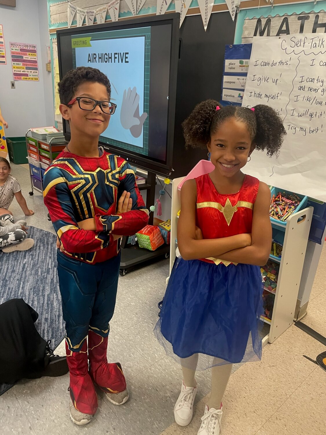 Third graders Jackson and Yasmine dressed up for HERO day!