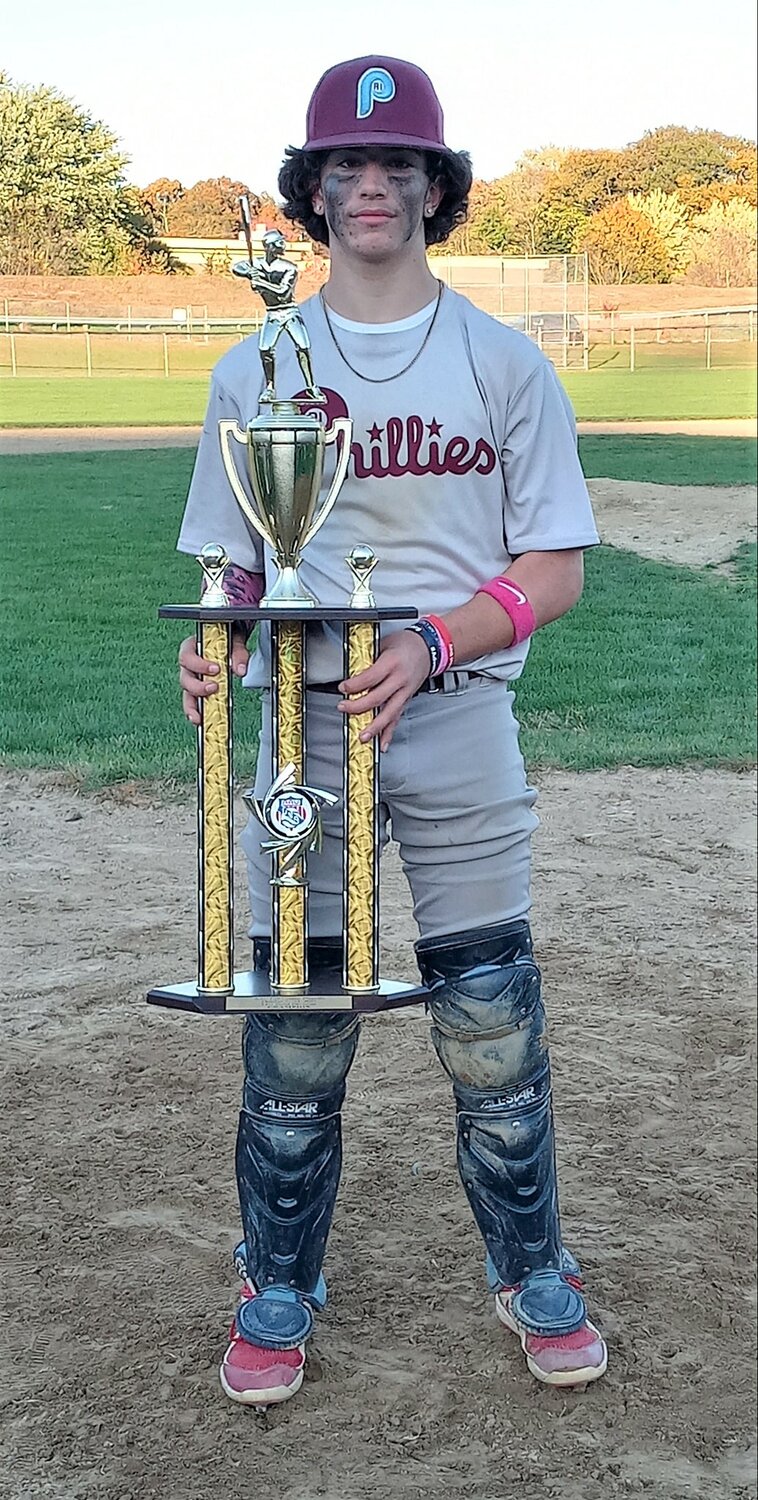 Jonathan JJ Renaud with the championship team trophy after AAU tourney win on October 28th. Renaud pitched a complete game shutout in the semi-final to gain the team's title appearance.