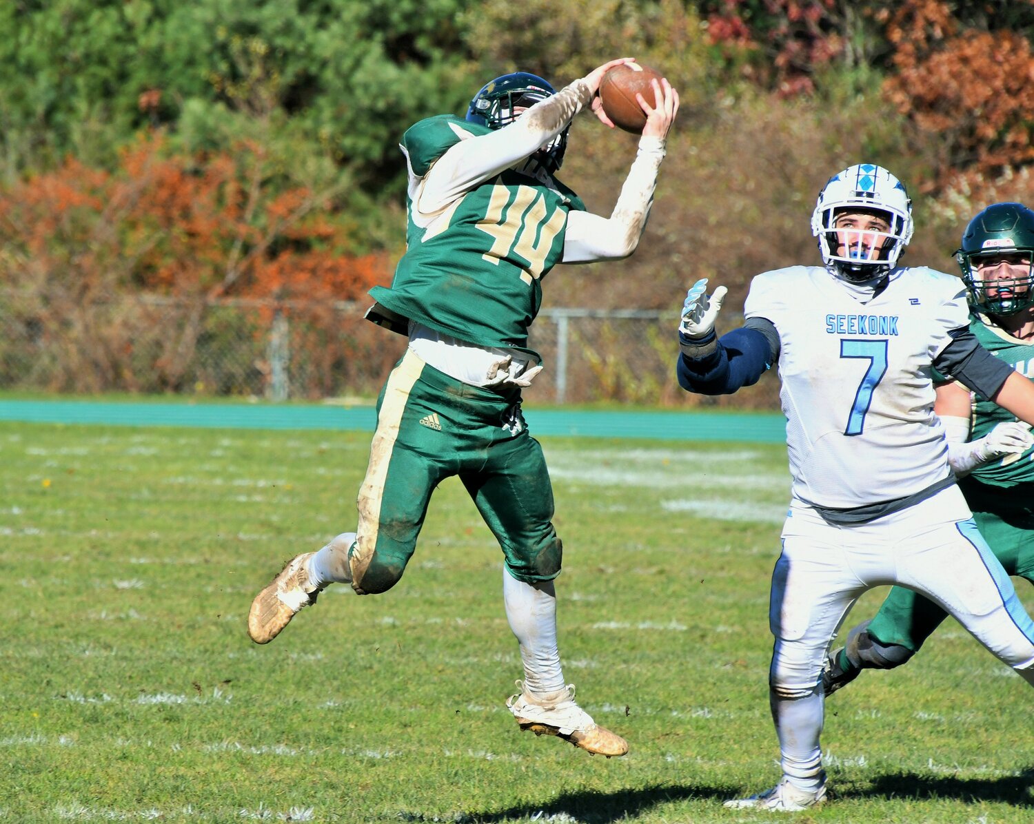 Kevin Gousie Jr. of Dighton Rehoboth cuts in front of Seekonk's Joey Nolan for an interception that he returned for a touchdown.