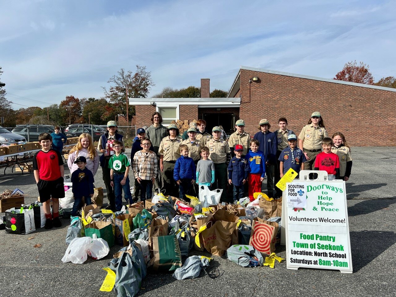 Scouts and parents from BSA Troops 1 & 9, and Cub Scout Pack 88, worked hard to collect over 8,000 pounds of food for Doorways Food Pantry to supplement holiday tables