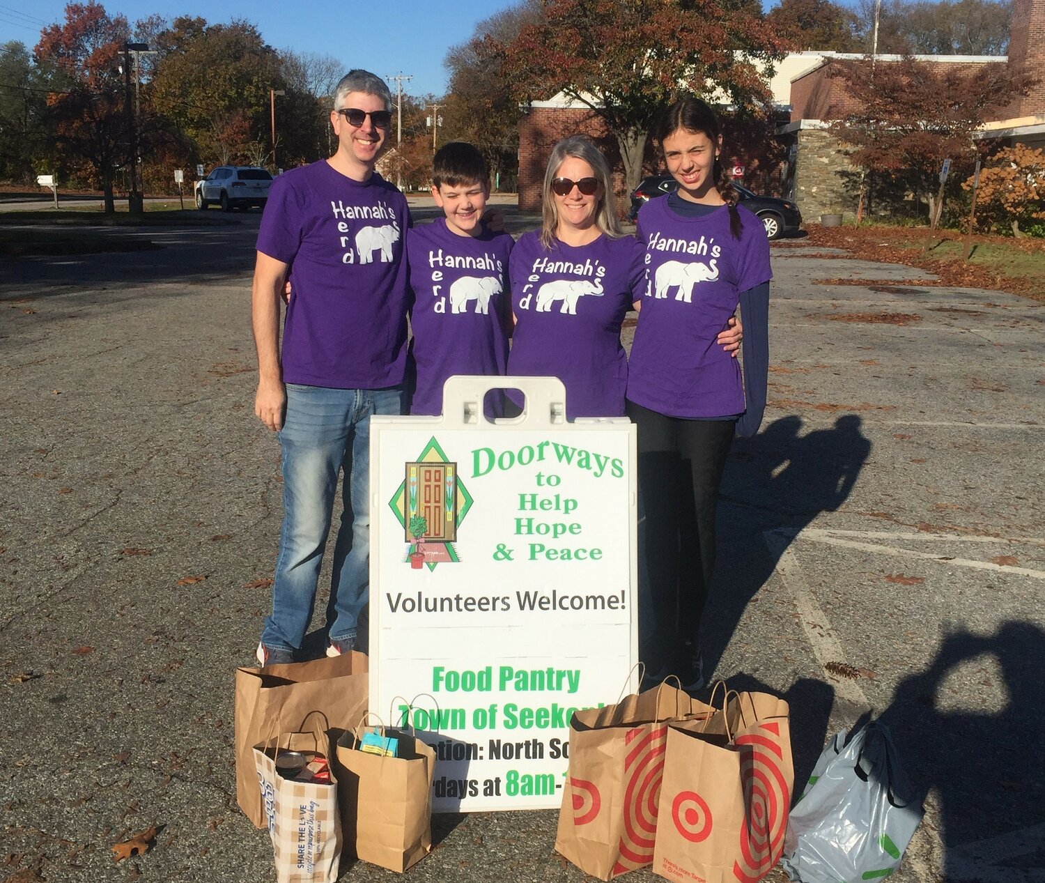 Members of the Baldassi family drop off food collected during the 3rd Annual “Hannah’s 5K Run for Charity”. This is the third year the run has collected food for Doorways.