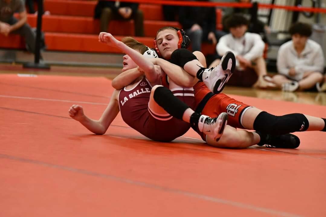 Deacon McShane of EP getting the best of his opponent with an impressive pin in wrestling victory
