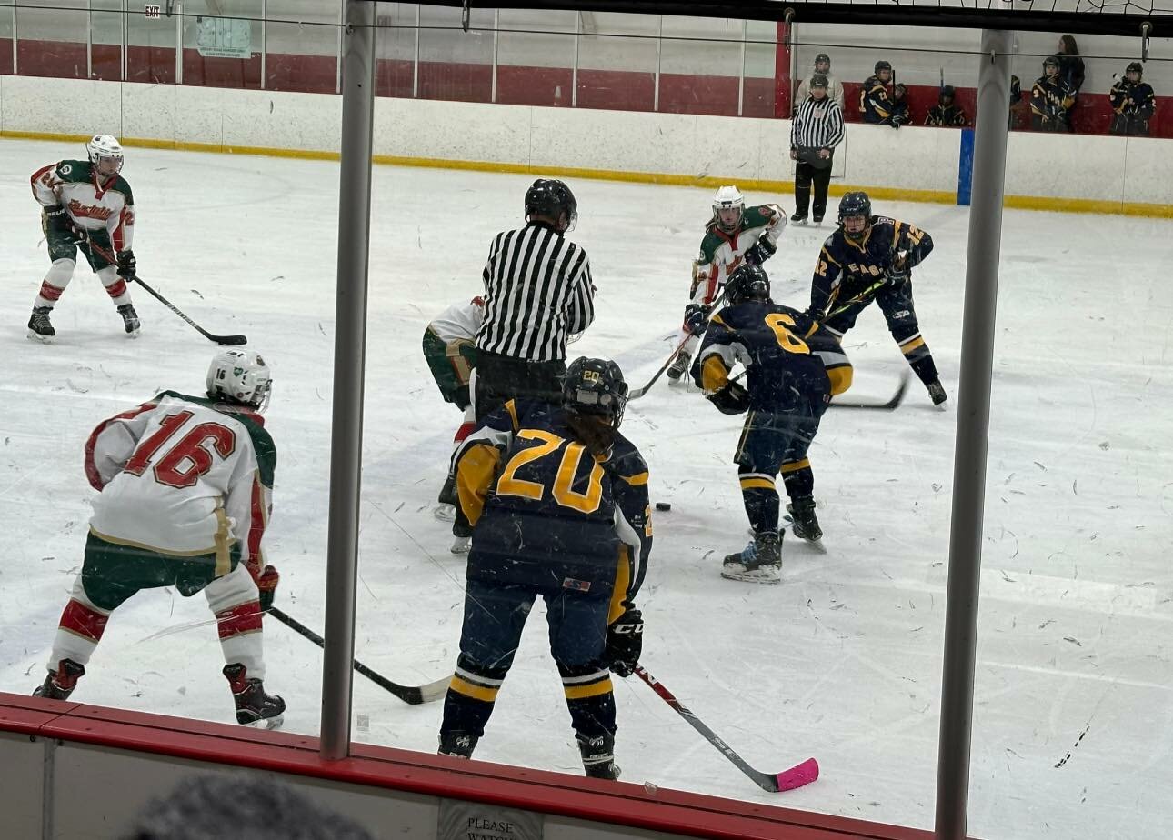 East Bay Co-op player #6 Sydney Olson on the ice for the winning team