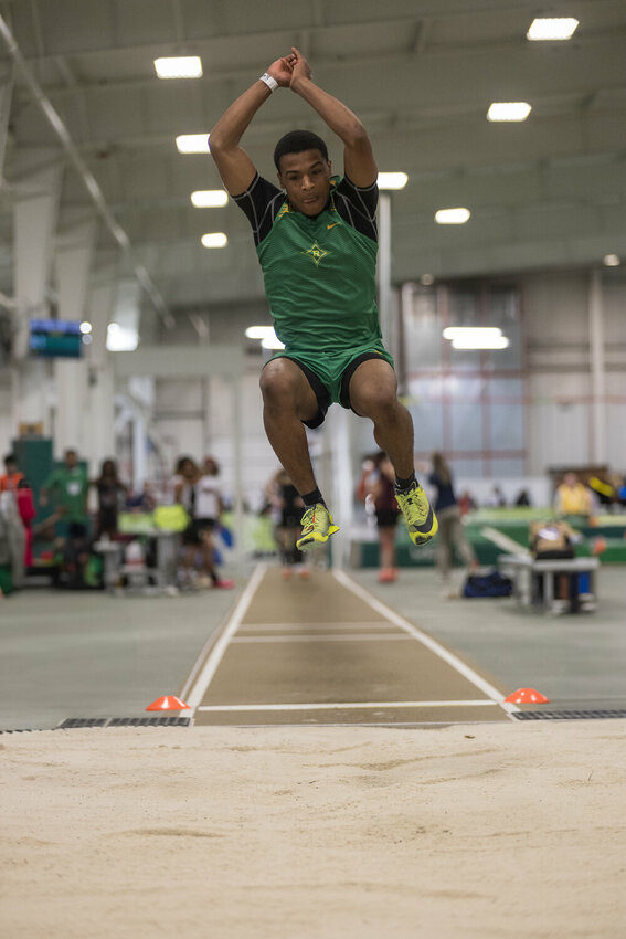 Junior Keonta Pegues competes in the long jump state championship in Winston-Salem.
