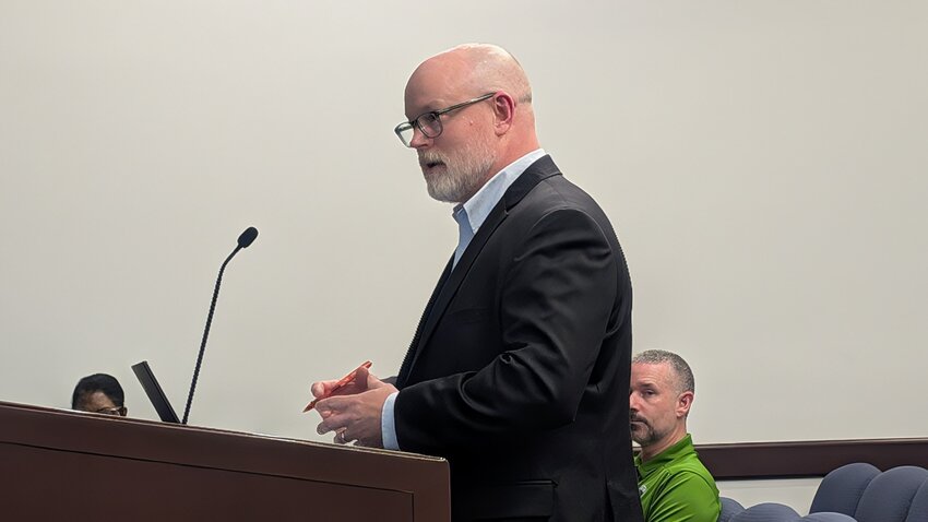 Eddie Moore of McAdams briefly addresses the Rockingham City Council during a public hearing on rezoning a property proposed for development.