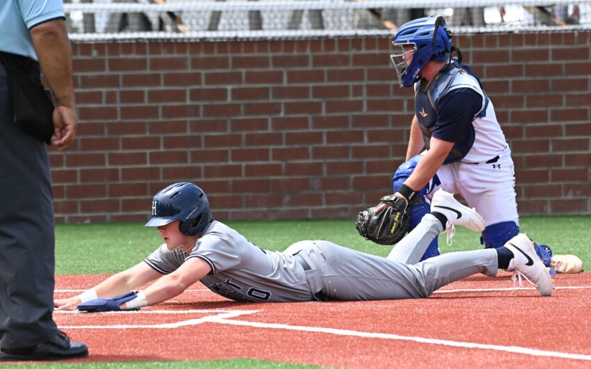 Caden Nolan, who had an RBI double Sunday, scores Hamlet