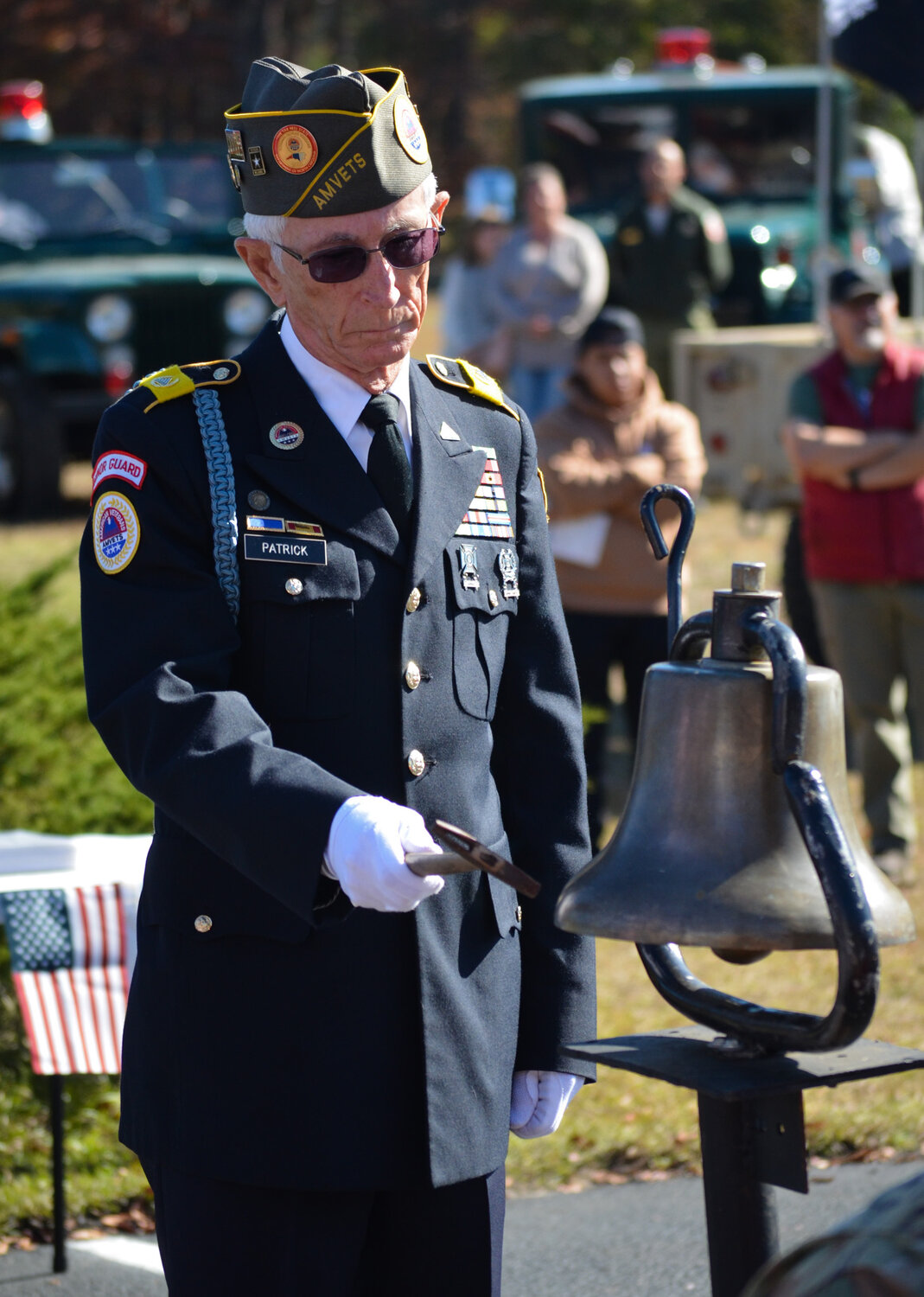 Johnny Patrick of AMVETS Post 316 tolls a bell for the Richmond County servicemen who were killed in the Vietnam War during Richmond County Hospice's annual Salute to Veterans on Nov. 3, 2023.