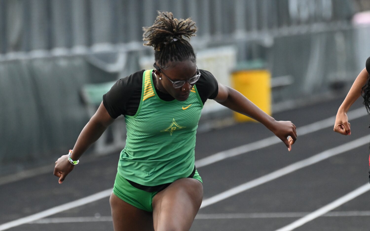 Senior Amariah Gibson crosses the finish line to win the 100-meter dash Thursday.
