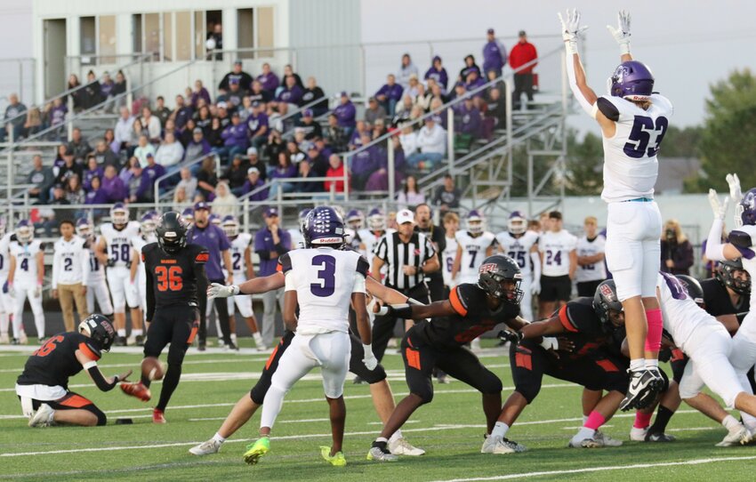 MOC-FV's Draeden Punt 's (53) leap isn't enough as Necco Rojas's field goal is about to hit the mark for a 23 yarder. That's Brayden Kerr holding.