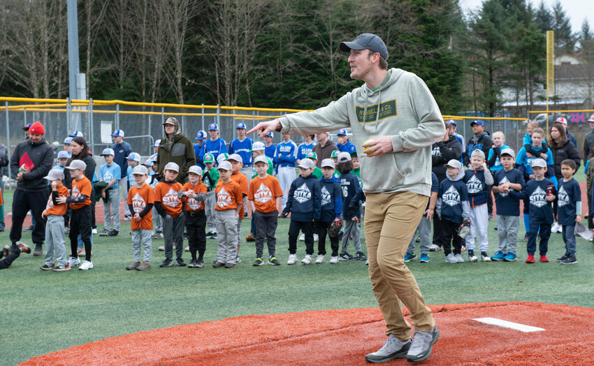 MAYORAL FIRST PITCH -- Sitka mayor and businessman Steven Eisenbeisz throws out the first softball of the season Saturday on Moller Field during opening day ceremonies. (Sentinel photo by James Poulson)