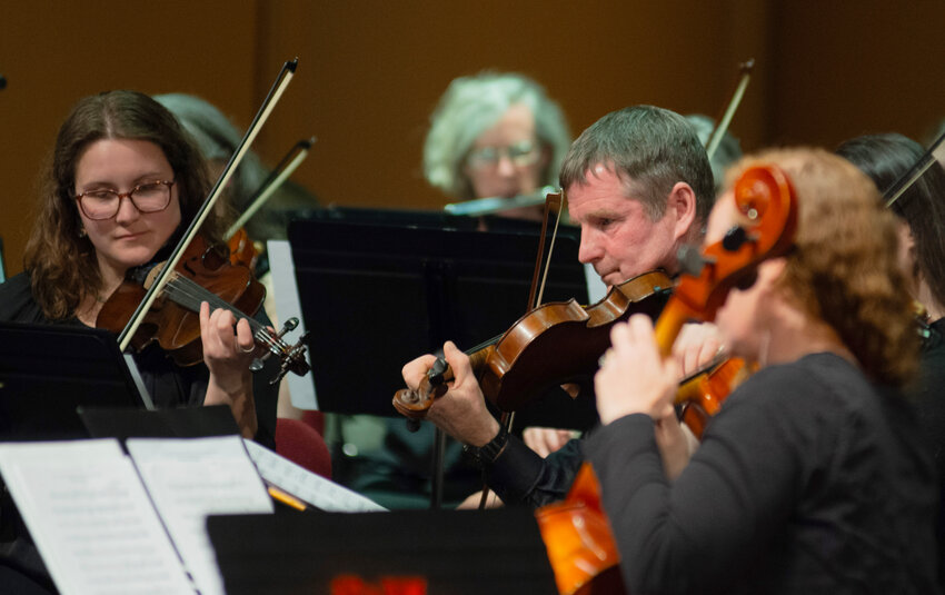 Members of the Sitka Community Orchestra play in at the Performing Arts Center in 2024. This year's free concert is Friday.