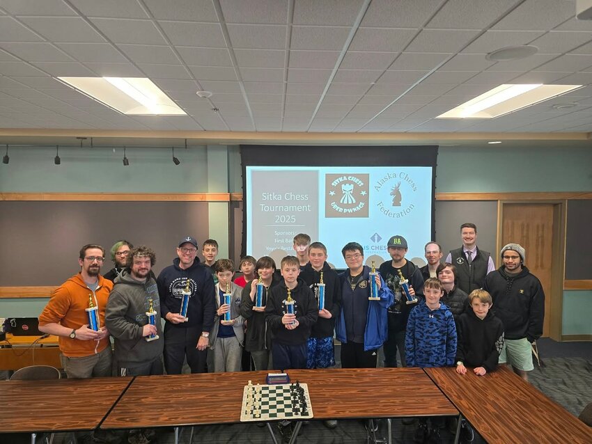 SITKA CHESS TOURNAMENT – Participants in the First Bank Sitka Chess Tournament line up following the tourney May 17 in Sitka. It was Sitka Chess Club’s first rated U.S. Chess Federation event. Tournament Director Reilly O’Hara, Alaska Chess Federation, traveled from Anchorage to run the event. Final tournament standings are: Rated Open, first Alexander Allison, second Joey Mudry, third Zeke Blackwell. Rated Scholastic, first Marcus Bakkes, second Sylas Degner, third Riot Lindbergh. Unrated Open, first Stephen Black, second Kaeden Skultka, third Harry Lysons III. Sitka plans to send a contingent to the Alaska State Championship on Oct. 4 in Anchorage. Appreciation was extended to the tournament’s corporate sponsors, First Bank, and to the Alaska Chess Federation. (Photo provided to the Sentinel)