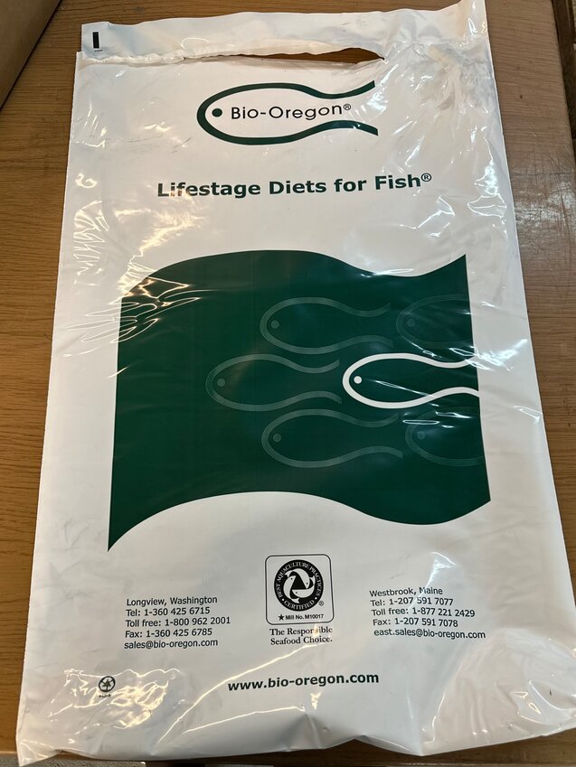 Thousands of empty, plastic fish feed bags fell off of a Lituya Freight Runners barge in the lower Chatham Strait region in May. Mariners can report sightings of the green-and-white bags, which measure about two feet by three feet, by emailing seakmarinedebris@gmail.com.