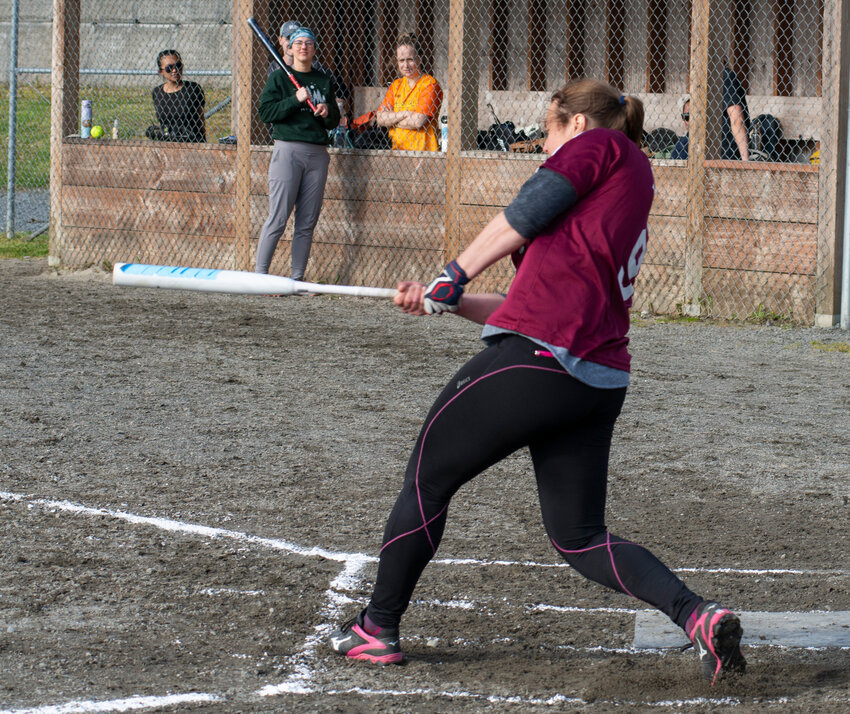 Lauren Bell hits a grand slam homerun Tuesday night at Kimsham Field in city league action.