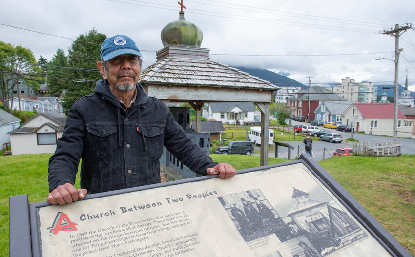 Bob Sam stands behind an informational sign in the Russian Cemetery off Marine Street today. Sam, who has worked to restore Sitka graveyards since the 1980s, has been involved in a project to find the exact burial site of Saint Yakov, 1802-1864. Yakov was canonized by the Orthodox Church in 1994.