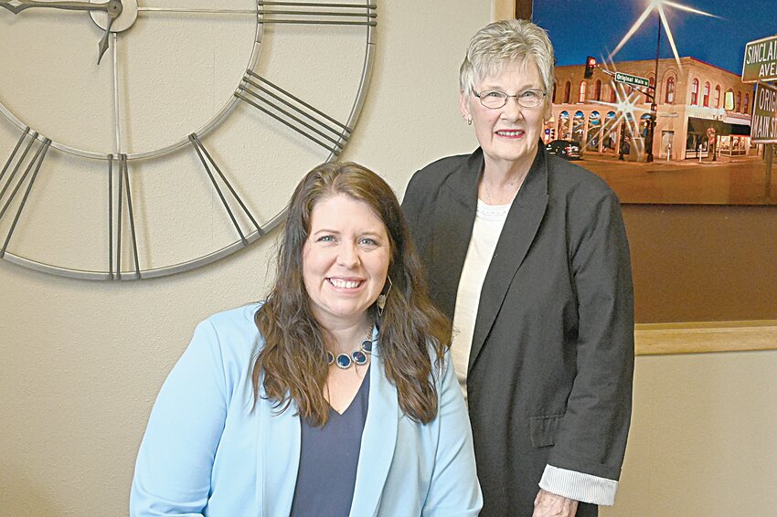 Sara Hoffner (left) and Pam Borgmann gather June 10 before Hoffner begins her day as the executive director of Visit Sauk Centre, a tourism bureau, in Sauk Centre. Borgmann, who resigned from the position in May helped Hoffner adjust to the new position.