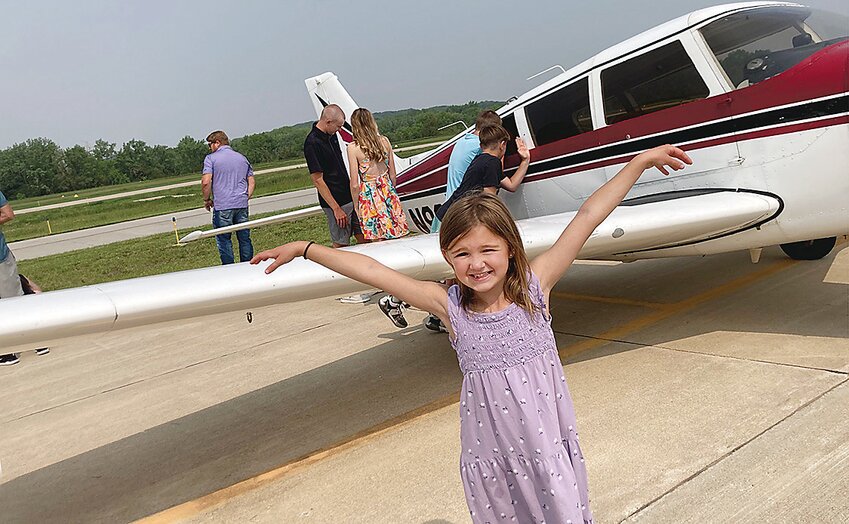 Blake Ludvigson, age six, shows off her family’s plane at Sunday morning’s Flight Breakfast at the Cherokee Airport.