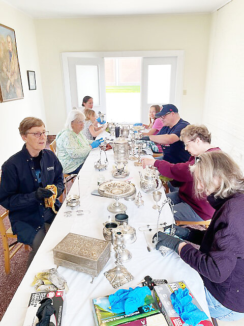 Trustees, guides and other volunteers are at work, from left: Sue Lyngaas, Deb Langner; trustee Roger Redig’s daughter, Rachel and her two daughters, Lee Dutfield, Carol Huntzicker and Christine Samuelson. Not pictured but working to gather and return silver items to their display areas were Roger Redig and Justin Yarosevich.