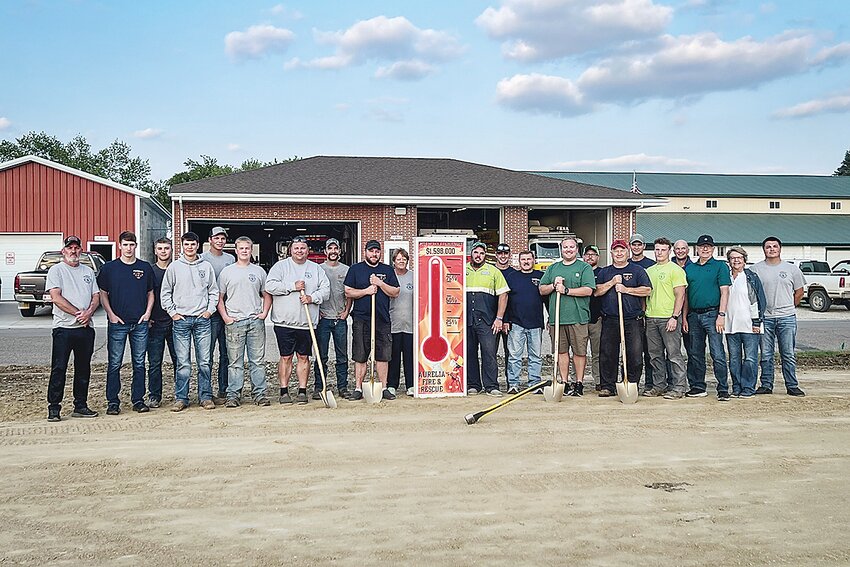Ground was broken Tuesday, June 9, for the new Aurelia fire station. From left: Chris Ernst, David Bottjen, Cole Mier, Jake Erpelding, Tyler Erpelding, Kouper Schulenberg, Luke Erpelding, Blake Suhr, Mark Lindgren, Cindy Nelson, Fire Department and City Council; Brent Fassler, City Council; Ryan Cougill, Jim Bezoni, Spencer Bezon, Josh White, Tom Mier, Dustin Weiland, Brock Mier, Leigh Peterson, Les Todd, Diane Weathers, ADC; and Zach Erpelding.