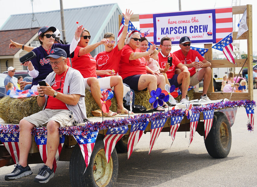 Decked out in red, white, and blue, this float carried the festive Kapsch crew ready to celebrate.