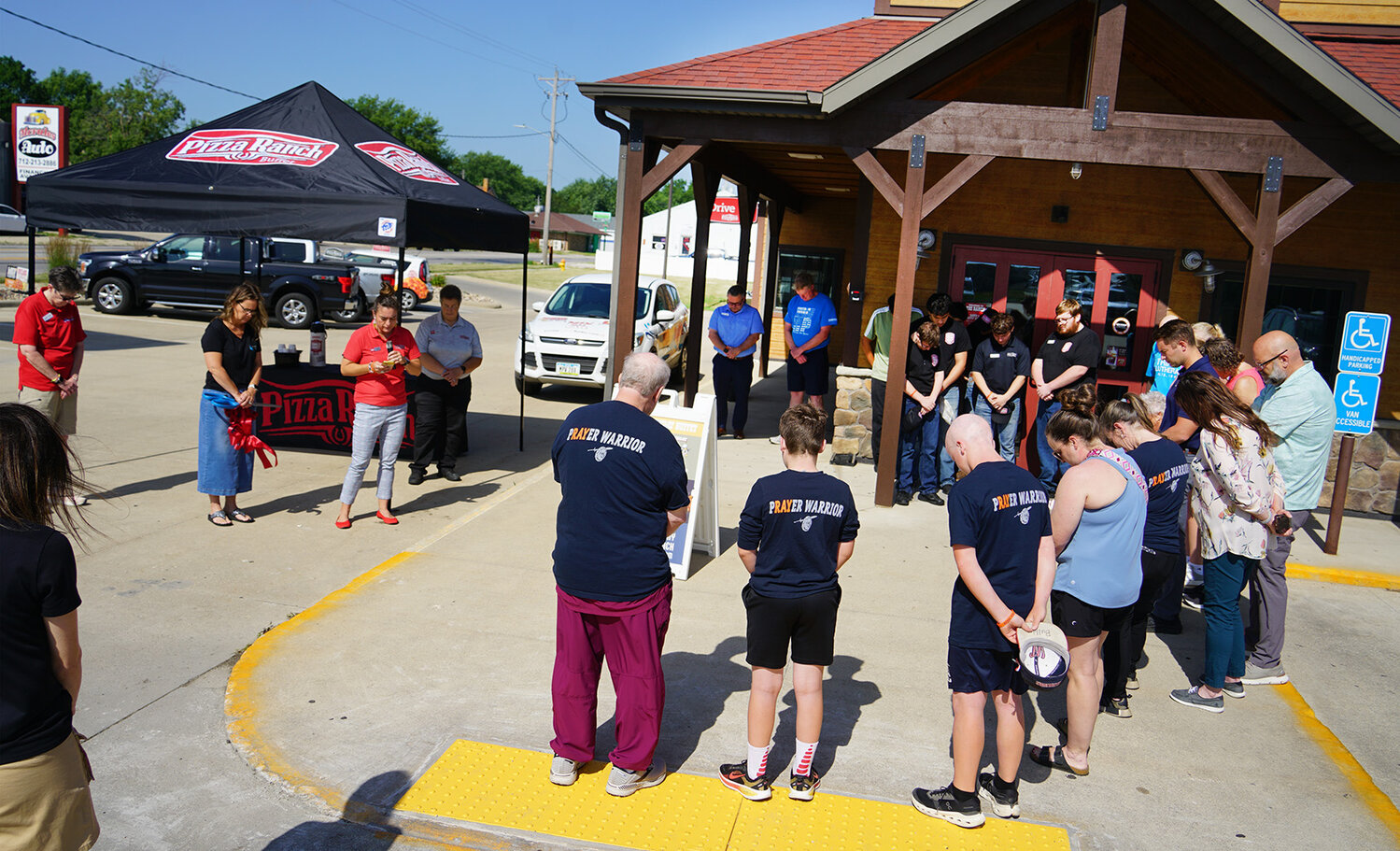 At the Pizza Ranch anniversary party: ribbon cutting, new owners, support for Hansen family