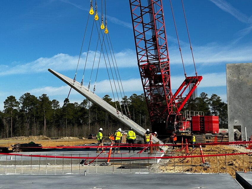 4,000 lb wall being lifted up by heavy-duty crane