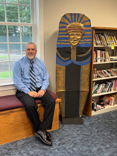 Carl Coffin with the sarcophagus at the Library