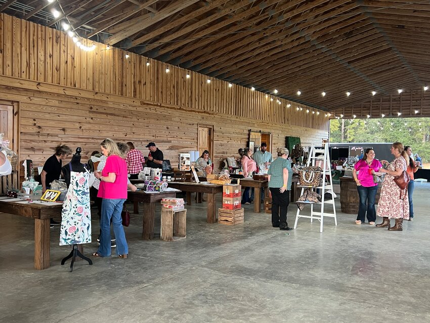 Crowd looking at auction items at Paws event