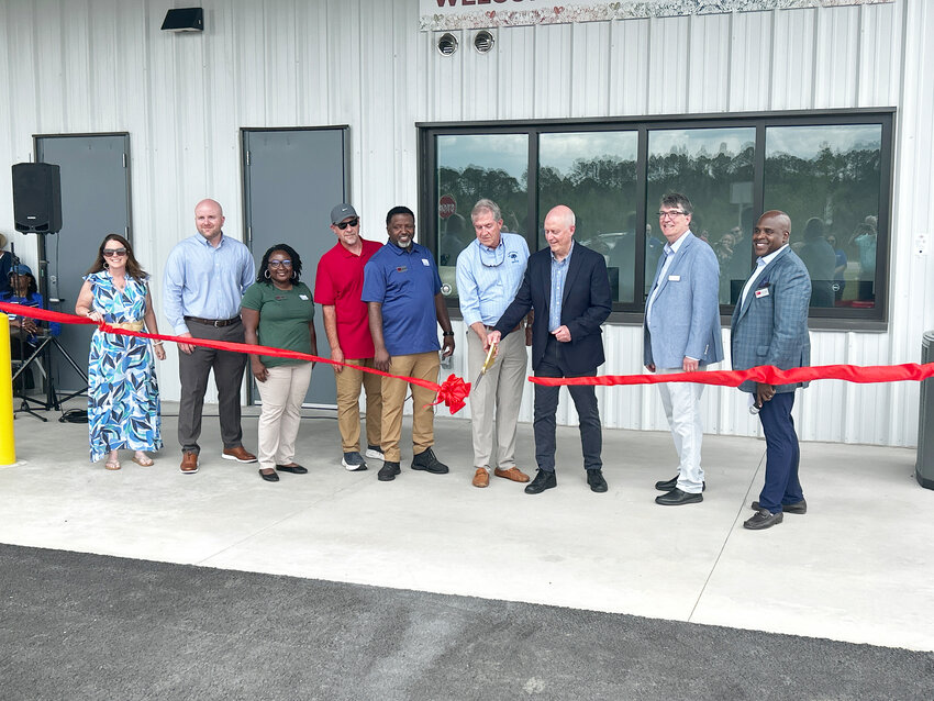 Second from right: John Flemming - Southern Carolina Development Alliance, Chief Operations Officer. Osborne and Weathers cut the ribbon to officially open the Lowcountry Food Bank Southern Regional Food Center in Early Branch