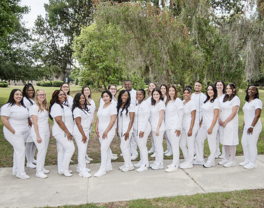 May 2025 Associate Degree in Nursing graduates L to R:  Asiyih Pellegrino, Abria Thompson, Brittany Cushman, Latriciana Brown, Katherine Reynolds, Nyshika Staley, Kaitlin Biggins, Ana Laboy, Kourtlyn Taylor, Allsion Brown, Darnelle Hazard, Sindoda Lawyer, Savannah Sampson, Karen Cuellar, Alicia Schiller, Dominique Karczewski, Dominique Padilla, Bryson Santiago, Carmela Ramirez, Taylor Adams, Ellisette Sinor and Precious Johnson