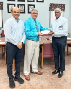 Left to right
Hariharan Venkataraman, Vice President of Sundaram-Clayton, USA in Ridgeville is shown with Dr. John Glenn Creel receiving a check for the Edisto Indian Free Clinic from R Venkatesh, Chief Operating Officer.